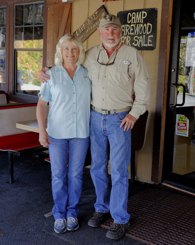 Wild Bill & Joanne Scruggs outside the Outfitter store